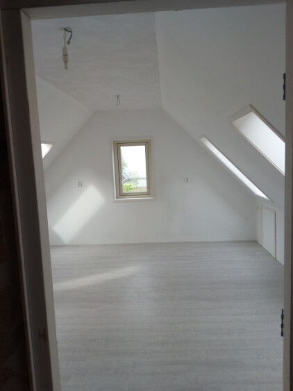 beschreven kamer aan de achterzijde van het huis